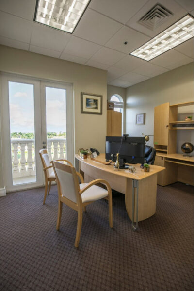 The interior of an executive office space in Boca Raton with a patio and nice view.