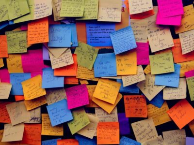 A bunch of sticky notes containing appreciation quotes for good work.