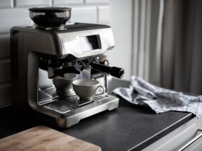 A touch screen coffee machine sitting on a countertop.