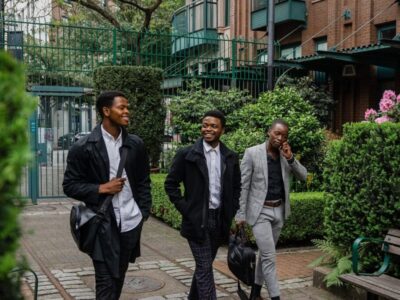 Three men wearing business casual attire.