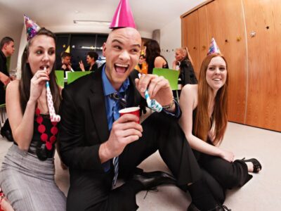 A group of coworkers celebrating a virtual retirement party.