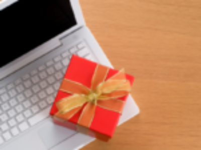 A gift on top of an open laptop.