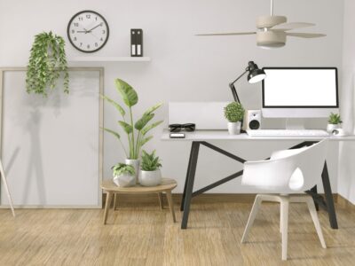 An office corner interior featuring a desk chair with no wheels